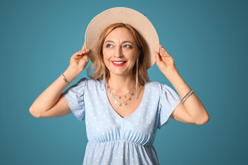 Canvas Print - Beautiful mature woman with stylish accessories on blue background