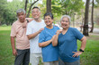 © Anatta_Tan - Asian elderly men and women Standing for photographers to take photos in the park before playing sports and exercising. Smile happily in retirement, take care of your health.