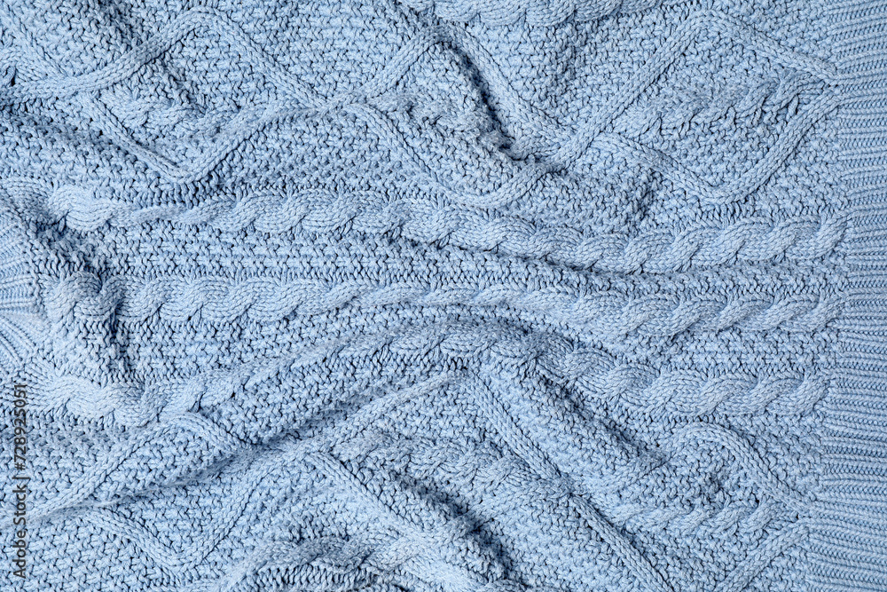Texture of stylish knitted fabric with folds as background