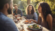 © basketman23 - A group of friends seated at a sunny outdoor table,  enjoying a social brunch