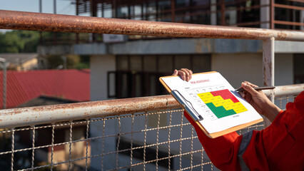 Wall Mural - action of a business manager is holding project risk assessment form on blurred background of train 