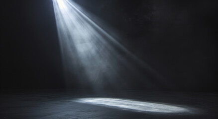 Spotlight shining down from an angle above onto a stage