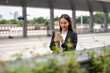 © StockPhotoRepublic - Young woman using phone outdoor