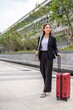 © StockPhotoRepublic - Asian businesswoman with luggage going on business trip