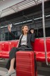 © StockPhotoRepublic - Young Asian Businesswoman Using Phone On The Public Skytrain