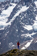 © Jakub - hiker girl walking alongside hooker valley track toward hooker lake and mt cook, famous walk in canterbury, new zealand south island