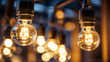 Closeup of hanging modern LED light bulbs with blurry bokeh background. Warm lighting,