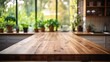 Empty wooden surface graces the kitchen, with verdant plants stealing the spotlight in the foreground.