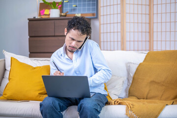 Wall Mural - Busy male professional businessman entrepreneur person sitting talking communication phone with working desk laptop notebook technology communication indoor home workplace, adult business man manager