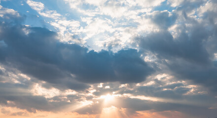Poster - Blue sky and white clouds background - Pillowy clouds cover a blue sky in the background