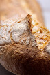 Close up shot of a baguette of french bread highlighting the crust and texture.