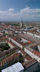 Wall Mural - The drone aerial footage of Turin city centre with Mole Antonelliana at sunrise, Piedmont region of Italy.