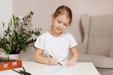 Sticker - Cute little girl drawing something with pencils