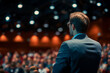 © Visual Craft - Speaker at Business Conference and Presentation, with the audience visible out of focus