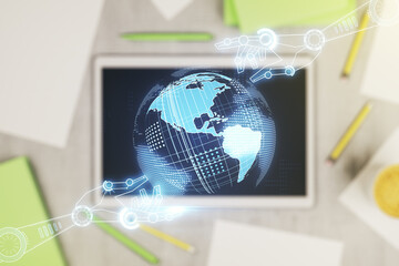 Wall Mural - creative concept of robotics technology with globe sketch and modern digital tablet on background, t