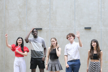 Group of young multiethnic friend having fun and laughing outdoors on beautiful summer day