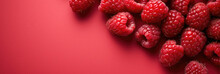 Red Raspberries On Red Background 