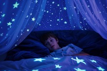 Boy Lying In Bed With Glowinthedark Stars On Ceiling