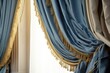 A picture of a blue curtain with decorative tassels. Suitable for home decor or interior design themes