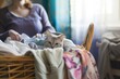 woman sorting laundry, cat hiding in the basket