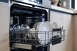 © Fotograf - A picture of a dishwasher filled with dishes in a kitchen. Suitable for illustrating household chores and cleanliness