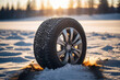 Winter tire with detail of car tires in winter snowy season on the road covered with snow