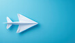 White Paper Airplane on Blue Background