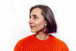 © Todayphoto - Profile of smiling dark-haired woman. Orange knitted warm sweater. White background isolated.