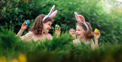 Sticker - children with painting eggs outdoors