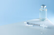 © VICTOR - syringe for injectable medication on blue background