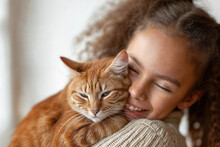 Young Girl Shares A Tender Moment With Her Orange Tabby Cat Generative AI Image