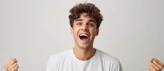 Wall Mural - Happy young man on white background.