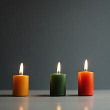 Three Burning Candles On Black Background