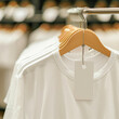 © Jira - A mockup of white tees in a store with a white prize tag
