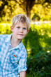 © Austockphoto - portrait of a child outside with copy space and neutral expression