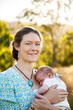 © Austockphoto - Portrait of a young mother and her newborn baby girl