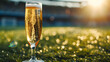 Cinematic wide angle photograph of a glass of champagne at a soccer stadium. Product photography.