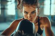 Woman Is Practicing Kickboxing, Emphasizing Empowerment And Selfdefense