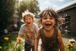© GVS - Children Laughing and Splashing Water in Garden