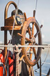 © MACO - Close-Up of wooden ships steering wheel on vintage ship.