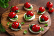 caprese ladybug tomatoes, mozzarella cheese and basil appetizers