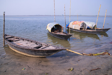 landscape view of Some wooden fishing boats on the shore of the Padma river in Bangladesh