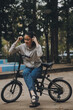 © ARMMY PICCA - Happy Asian young woman walk and ride bicycle in park, street city her smiling using bike of transportation, ECO friendly, People lifestyle concept.