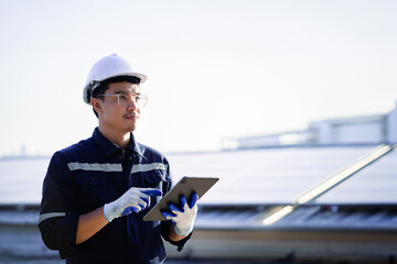 Energy engineer is inspecting and working outdoors on a building. Sustainable energy farm concept Solar cell farm.