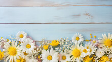 White And Yellow Daisies Arranged On A Blue Wooden Surface