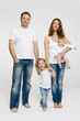 © MACO - Young family in the studio with white background (Mother, Father, two Daughters)