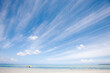© MACO - Landscape of beach and large blue sky with yellow boat. Mauritius