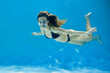 © makedonski2015 - A young woman in a swimsuit swims in the pool. Creative concept