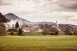 © MACO - Landscape image of field and houses with fog rolling in. Mozirje, Slovenia