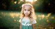 © Volodymyr - Cute beauty little girl in blossoming garden. Cute child girl near blossom garden. Pretty curly teen outdoor summer portrait. Kid girl in spring garden. Spring concept. Beautiful girl in orchard.